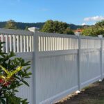Mary PVC fence gallery corner fence line with landscaped border by Queensland Fencing Specialists