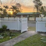 Eleanor picket-top privacy fence gallery front gate entrance at sunset by Queensland Fencing Specialists